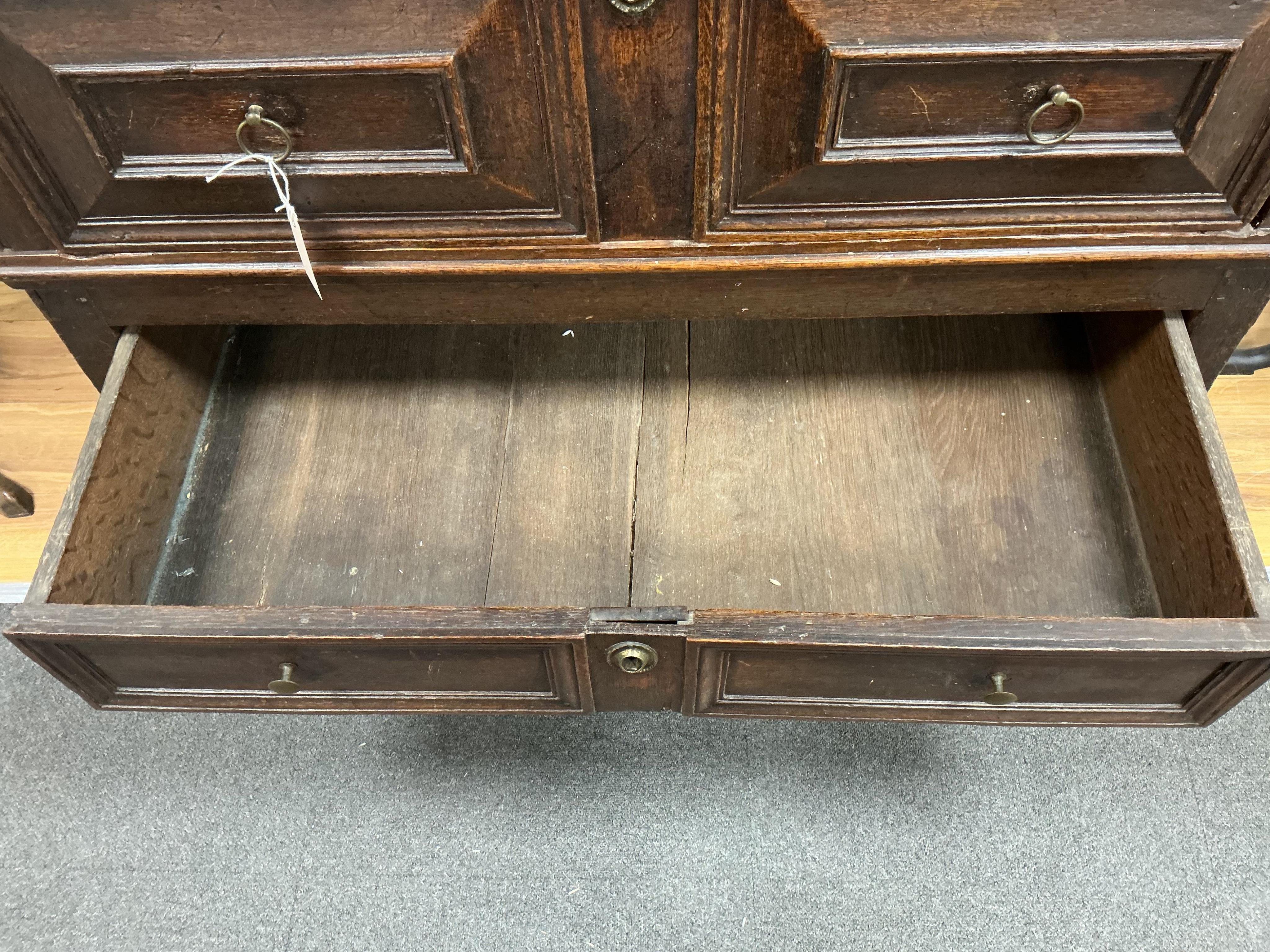 A William and Mary oak two part chest, width 108cm, depth 69cm, height 93cm.